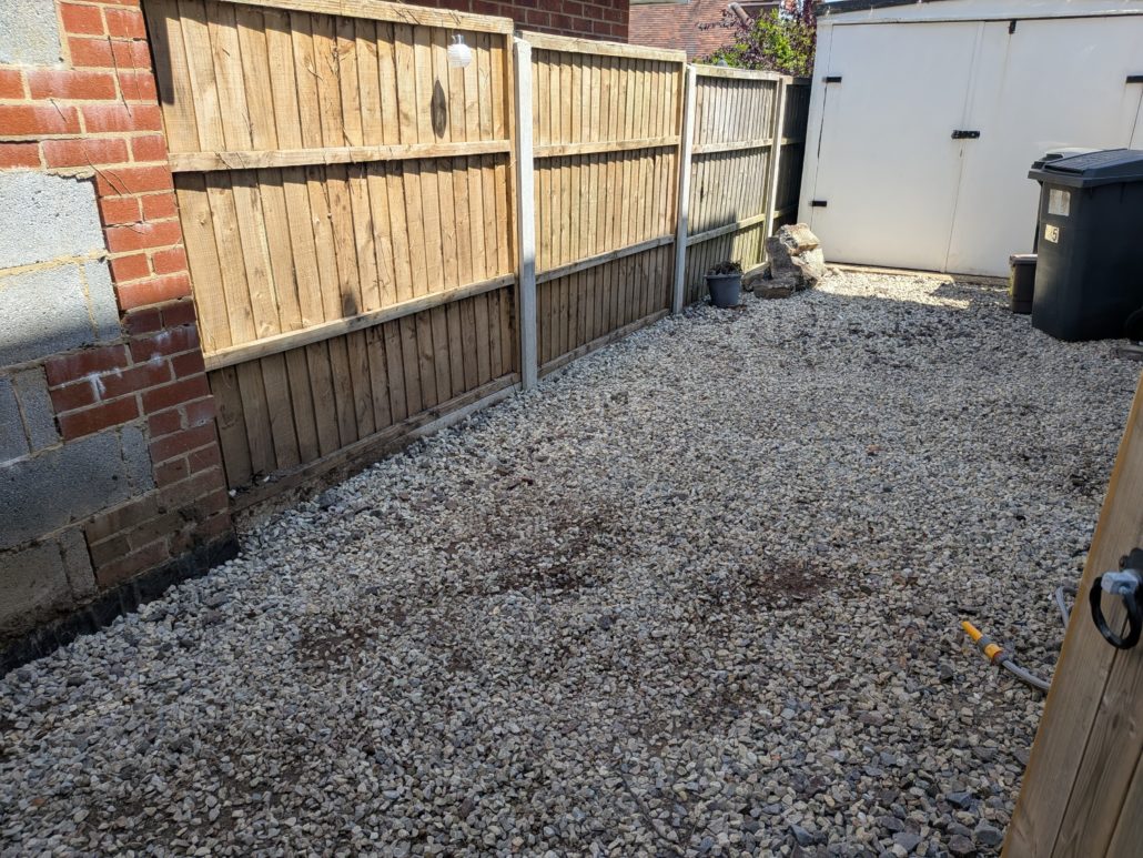 After photo of completed Fencing in Queens Park: Contemporary Slatted Driveway Gates and Parking Widening in Queens Park. - Gallery